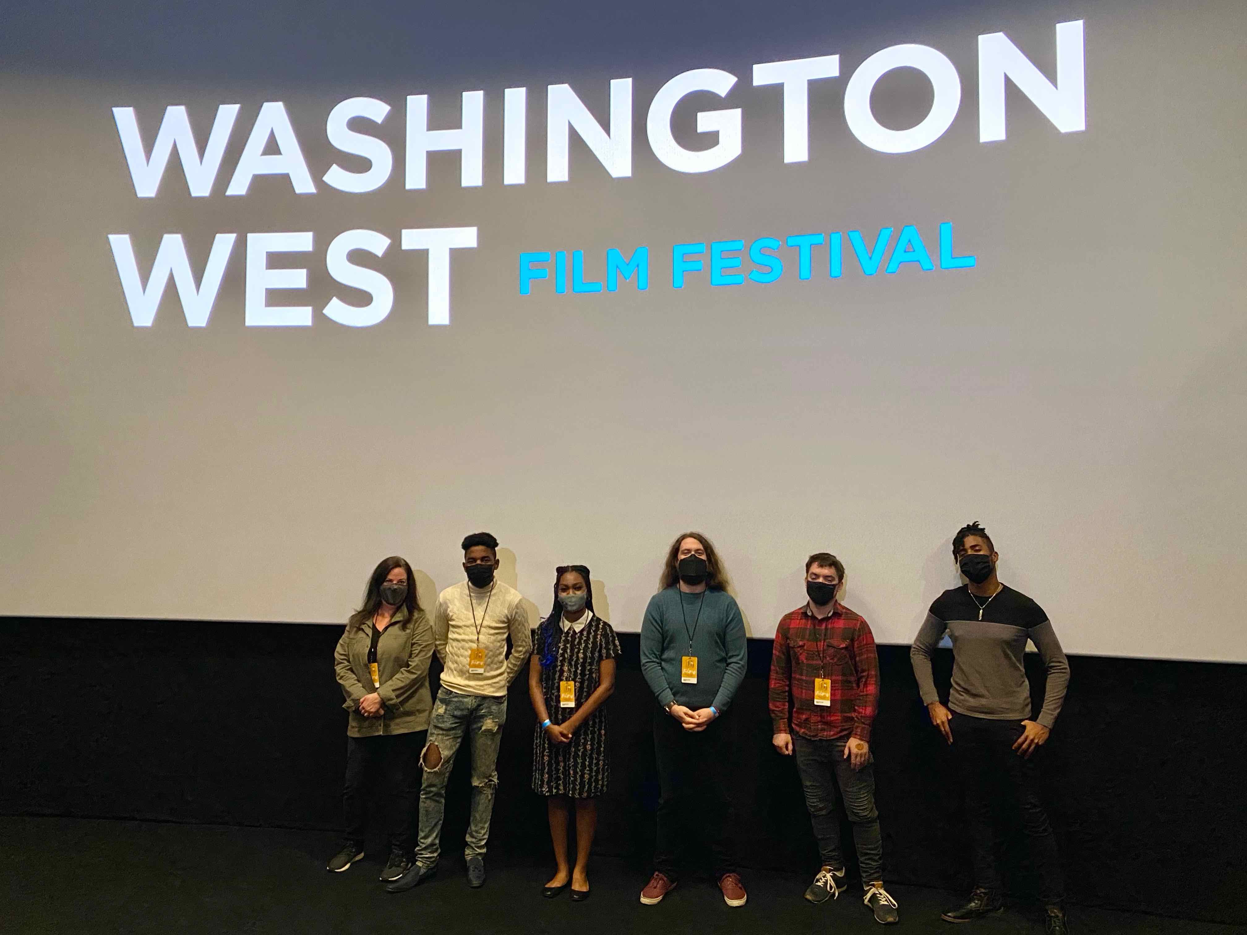 Students with Professor Lisa Thrasher presenting their films in the Best of Film at Mason Showcase at Washington West Film Festival. 